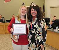  East HS Senior Alexandra Bock receives certificate from Dr. Robison, Superintendent