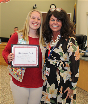 East HS Senior Alexandra Bock receives certificate from Dr. Robison, Superintendent